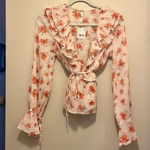 Free People beautiful blouse. New with tags! Size Small